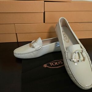 Tod's White Loafers with Gold Accent